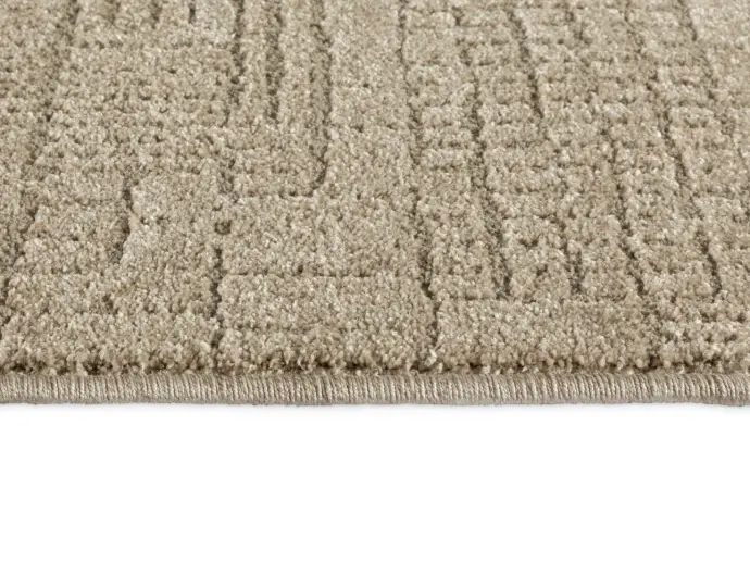 Foto der gekettelten Kante des Teppichs Tredito in Farbe Sand.