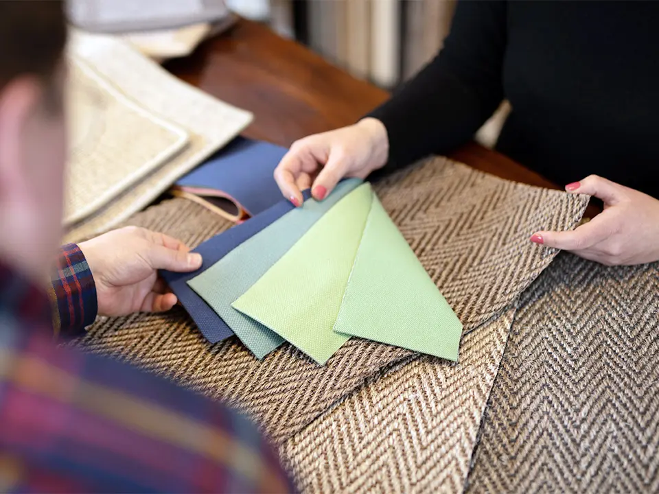 Close-up of carpet samples during a consultation at DEKOWE